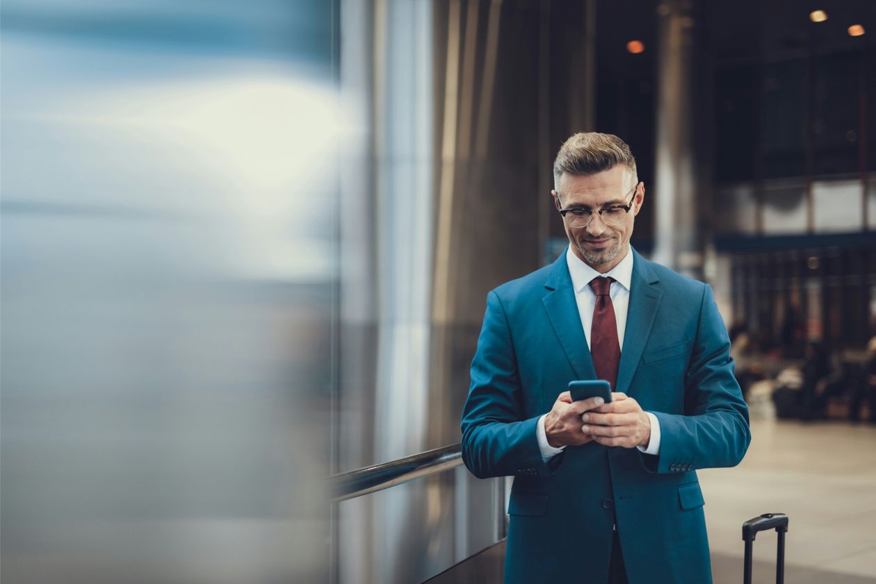 A lawyer checking a client update on his phone